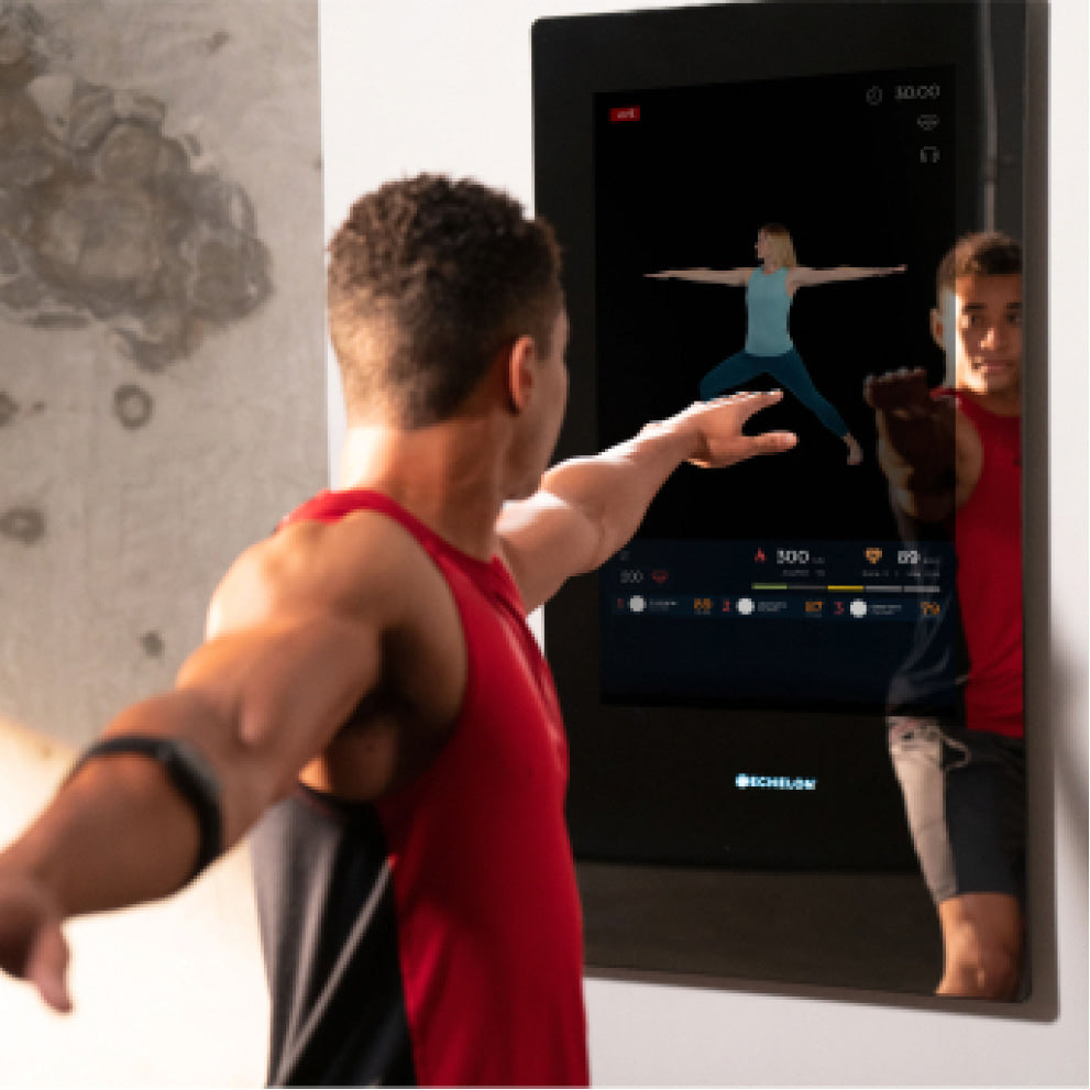 man using Echelon Reflect Touch interactive workout mirror
