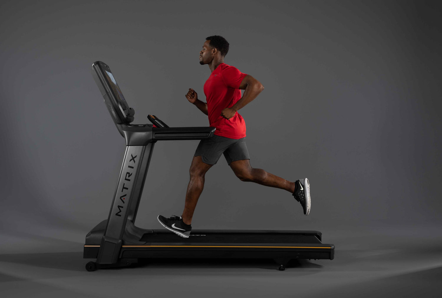 Man running on commercial treadmill from Matrix Fitness sold by The Fitness Connection a commercial fitness equipment dealer
